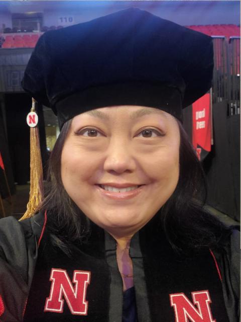 Graduate selfie in cap and gown